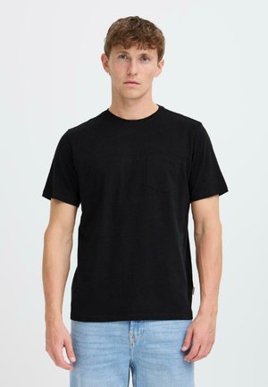 Black cotton t-shirt with a crew neck, short sleeves, and a left chest pocket. Relaxed fit with a smooth texture, displayed on a neutral background.