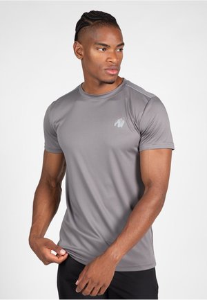 Gray athletic t-shirt with short sleeves, made of smooth, lightweight fabric. Features a subtle logo on the chest and contrasting seams.