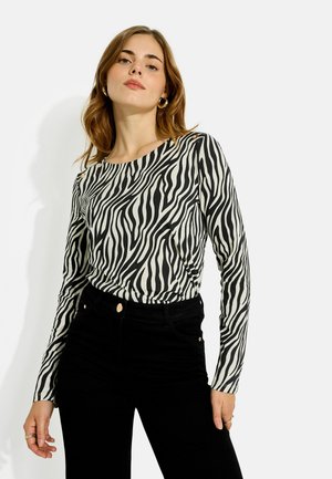 Grain de Malice, T-SHIRT MOTIF ZÉBRÉ BOUTONS - Blusa - noir