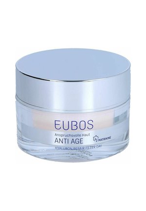 Round glass jar with a silver lid. Label features blue text "EUBOS ANTI AGE" and "HYALURON REPAIR FILLER DAY." Cream inside visible.
