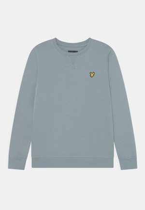 Lyseblå crewneck sweatshirt med ribbekanter ved ærmer og kant, med en lille gul fuglelogo på venstre bryst.