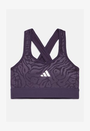 Purpurna sportska grudnjak s križnim trakama, s teksturiranim životinjskim uzorkom i bijelim Adidas logotipom sprijeda. Dizajn od rastezljivog materijala.