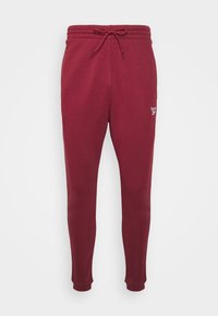 Burgundy joggers i en mjuk bomullsblandning, med elastisk midja och snörning, slim fit-design och broderad logotypdetalj.