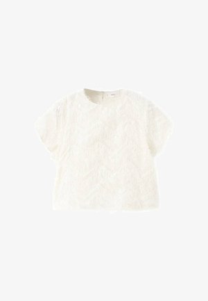 Top bianco a maniche corte realizzato in tessuto strutturato con un motivo ondulato. Presenta un collo rotondo e una cerniera sul retro nascosta.