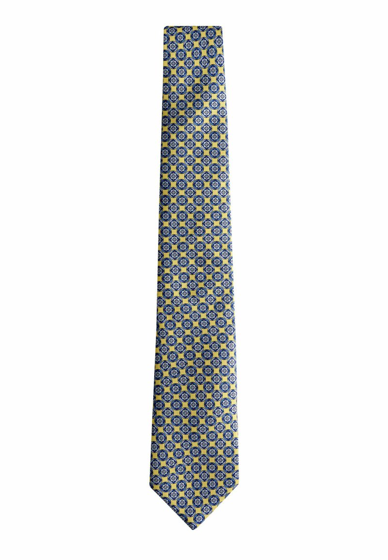 Corbata estampada con un diseño en azul y amarillo con pequeños motivos circulares. Fabricada con tela suave, estrechándose en ambos extremos.