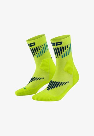 Bright yellow-green athletic socks with blue and black vertical stripe patterns and cushioned arch support, shown in a side-by-side pair.