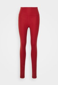 Leggings rojos con una cinturilla alta, hechas de un material suave y elástico. Presentan un diseño ajustado y una construcción sin costuras para un aspecto elegante.