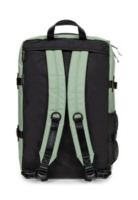 Zaino nero e verde menta con spallacci imbottiti, chiusure a zip e tasche laterali in rete. Presenta fibbie in metallo per sicurezza e regolazione.
