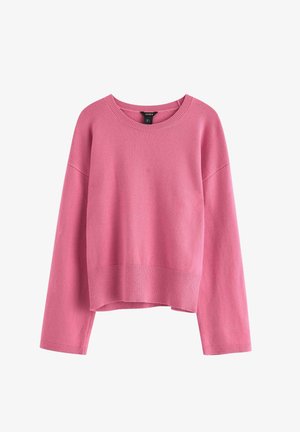 Maglione rosa lavorato a maglia con maniche lunghe, polsini e orlo a coste, scollo rotondo e design leggermente corto. Tessuto morbido e colore uniforme in tutta la superficie.