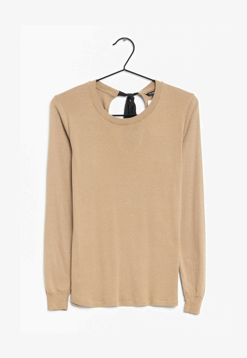 Long-sleeve beige top with a rounded neckline and a black tie accent at the back. Made of soft fabric with a smooth texture.