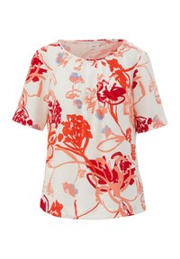 Kortekorte blouse van witte stof met een levendig rood en blauw bloemmotief. Heeft een ronde halslijn en plooidetail.
