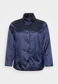 Mørkeblå, blank puffer-jakke med ståkrave og trykknaplukking, lange ermer og en litt løs passform.