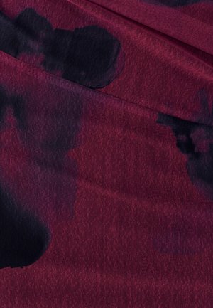 Textile featuring deep burgundy base with black abstract patterns, slightly textured surface, and subtle variations in hue.