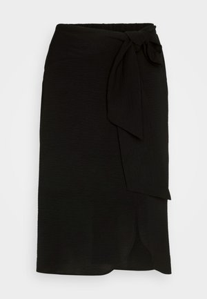 Black wrap skirt made of textured fabric, featuring a side tie, straight design, and a slit at the hem.