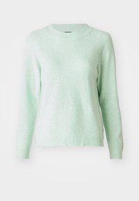 Mjuk ljusgrön långärmad stickad tröja med ribbad rund halsringning, ärmslut och nederkant, uppställd mot en vit bakgrund.