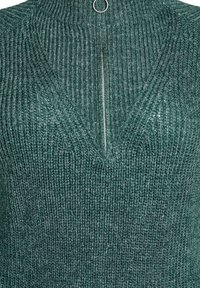 Žalias megztas megztinis su tekstūruotu, dryžuotu raštu. Turi V formos iškirptę ir užtrauktuko užsegimą su metaliniu žiedo akcentu.