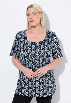Tunica corta blu navy con maniche a sbuffo e scollatura quadrata, caratterizzata da un motivo paisley bianco e una vestibilità rilassata. Texture liscia, lunghezza fino ai fianchi.