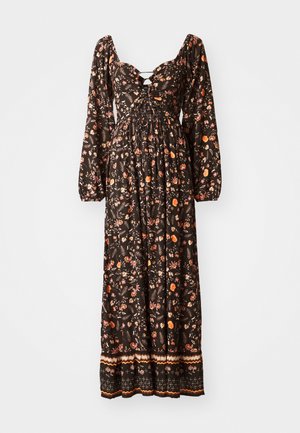 Svart blommig maxiklänning med långa puffärmar, rundad halsringning, rynkad bodice och ett mönstrat nederdel. Har färgglada blommönster.