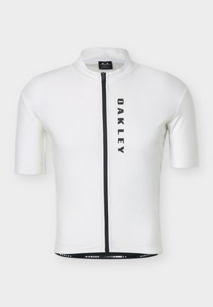 Fehér rövid ujjú kerékpáros mez fekete függőleges cipzárral és az "OAKLEY" felirattal, amely függőlegesen van nyomtatva a jobb elülső oldalon.