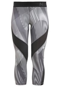 Leggings de Nike en negro y gris, con un patrón geométrico, paneles de malla y una cinturilla ancha, diseñados para ofrecer flexibilidad y transpirabilidad.