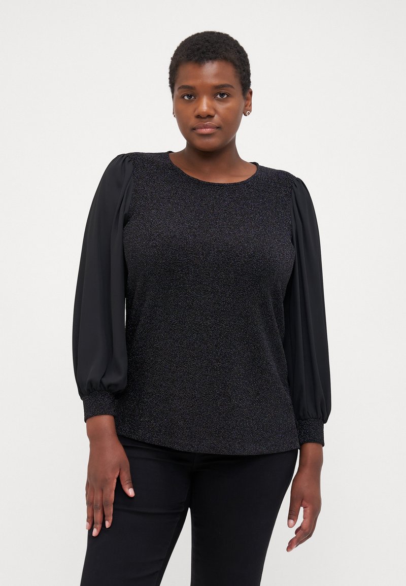 Black blouse with textured bodice and smooth puff sleeves, featuring gathered cuffs. Material has subtle shimmer, creating a sophisticated look.