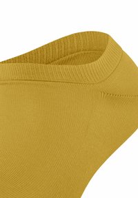 Senfgelbe, gerippte Baumwollsocke für den Knöchel mit glatter Textur, ausgestattet mit einem abgerundeten Bund und nahtlosem Design für maximalen Komfort.