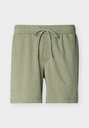 Pantaloncini verde chiaro con coulisse, vita elasticizzata e texture sottile, mostrati distesi su uno sfondo bianco.