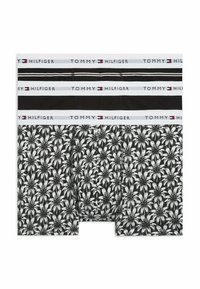 Ensemble de deux boxers pour hommes, l'un noir avec des rayures blanches, l'autre noir avec un motif de feuilles de palmier blanches, tous deux avec des ceintures blanches brandées Tommy Hilfiger.