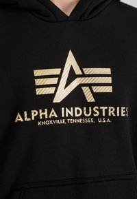 Alpha Industries Jersey con capucha - black gold