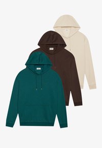 Three hoodies in dark green, brown, and beige. Each features a front pocket, drawstring hood, and long sleeves. Soft fabric texture.