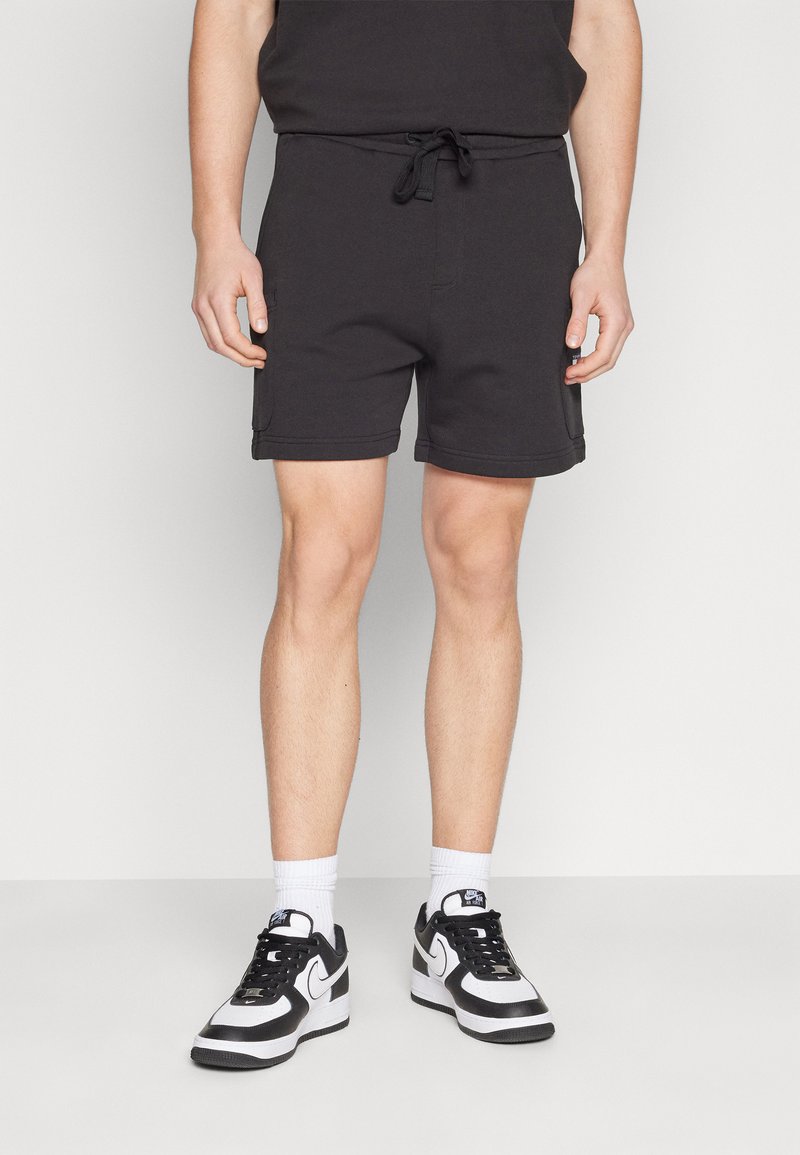 Tommy Jeans BADGE CARGO  - Tracksuit bottoms - black