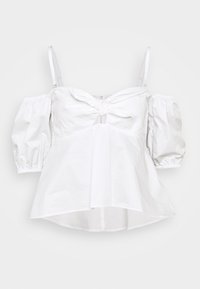 Blusa bianca off-shoulder con maniche puff 3/4, spalline sottili e regolabili, nodo anteriore e orlo leggermente svasato.