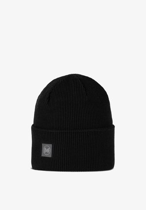 Gorro de punto negro hecho de tela acanalada. Cuenta con un puño vuelto y un pequeño parche gris con el logo en el lateral.