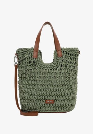 Green crochet tote bag with brown leather handles and adjustable shoulder strap, featuring a rectangular brand tag on the front.