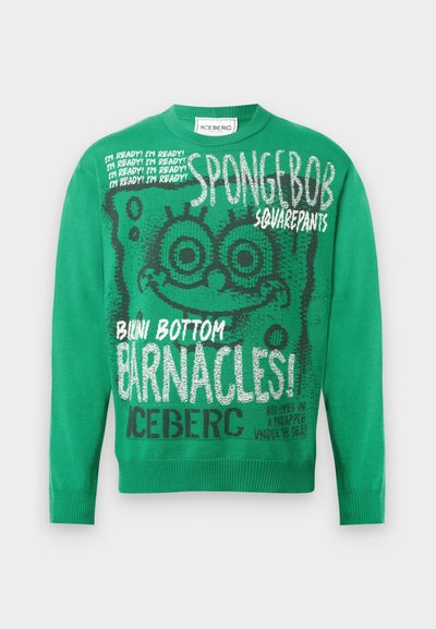 Pulover verde tricotat, cu grafică SpongeBob Pantaloni Pătrați, modele de text și manșete tricotate. Fraze notabile includ „Sunt gata!” și „Scoicile!”