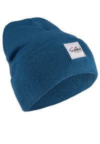 Blue knit beanie hat featuring a ribbed texture, close-fitting design, and a white fabric patch with black logo on one side.