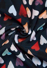 Fabric with a dark background featuring various colored hearts in red, pink, white, and blue. Smooth texture with a slightly glossy finish.