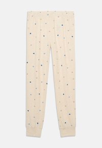 Ανοιχτό μπεζ πιτζάμες με ελαστική μέση και μικρά πολύχρωμα μοτίβα καρδιών σε ροζ, μπλε και πράσινο σε όλη την επιφάνεια.