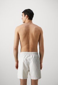 Calvin Klein Swimwear MEDIUM DRAWSTRING - Swimming shorts - stony beige
