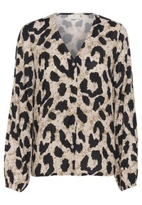 Blouse à boutonnage léger, avec un fond beige et un imprimé animal noir et marron, décolleté en V et manches longues. 
