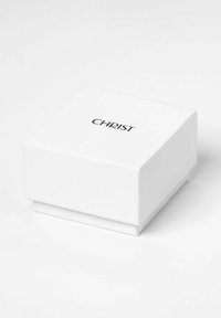 Weißer quadratischer Kasten mit einer glatten matten Oberfläche, das Logo "CHRIST" in Schwarz an der Oberseite, mit einem einfachen, klaren Design und ohne zusätzliche Dekorationen.