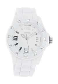 White silicone watch with a round face, silver accents, clear markers, and decorative crystals around the bezel. Features a textured strap.