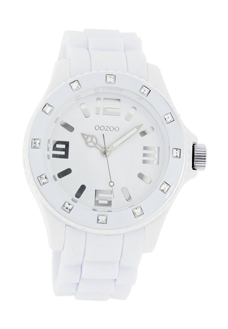 White silicone watch with a round face, silver accents, clear markers, and decorative crystals around the bezel. Features a textured strap.