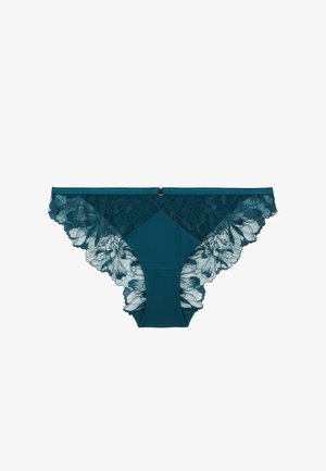 Culotte en dentelle teal avec des motifs floraux et des bords festonnés, dotée d'un tissu uni au centre et d'un petit détail en métal à la taille.