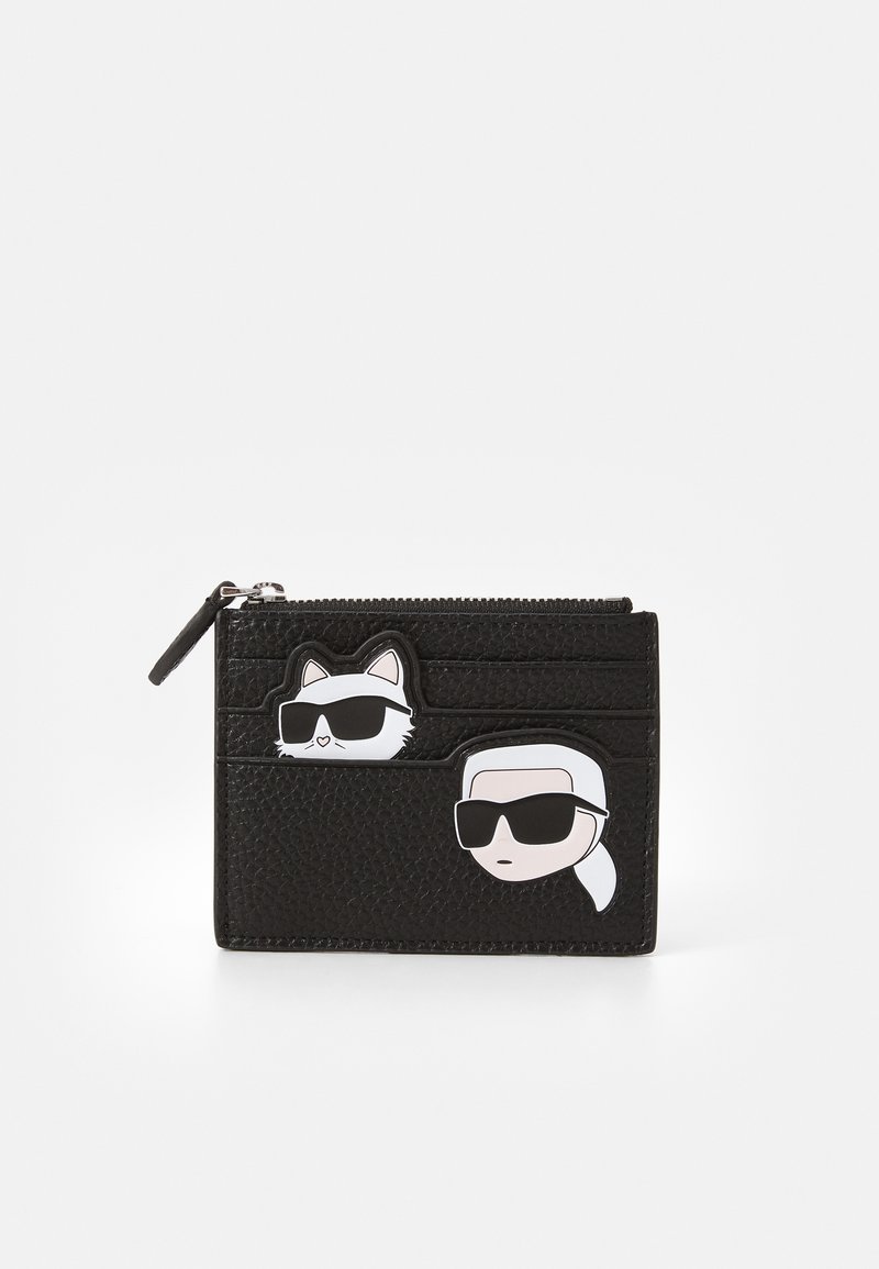 Black leather wallet with a zippered compartment, featuring cartoon cat and figure accents wearing sunglasses. Multiple card slots visible.
