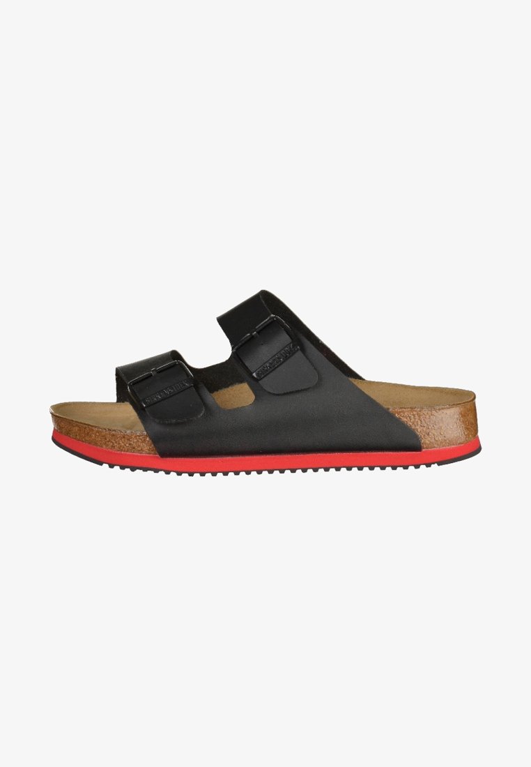 Black slip-on sandal with two adjustable straps and a cork footbed. Features a red rubber sole and smooth texture.