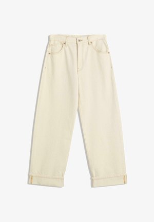 Cream-colored denim pants with a relaxed fit, featuring rolled cuffs, contrasting orange stitching, and front and back pockets.