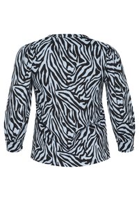Zebra-patterned blouse featuring a light blue background with black stripes, long sleeves, and a rounded neckline. Textured fabric.