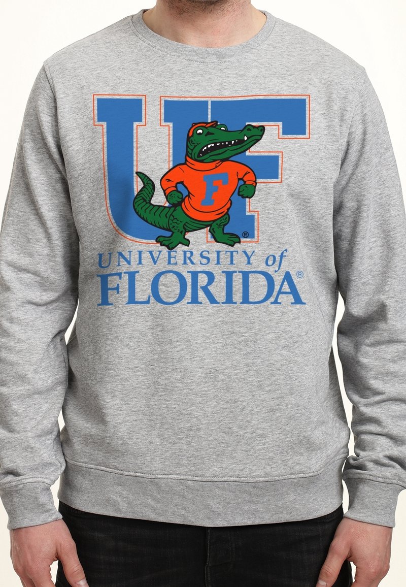Sweat-shirt gris avec de grandes lettres bleues "UF", une mascotte alligator en pull orange avec un "F" et le texte "University of Florida" en dessous.