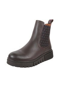 Brązowy skórzany botek za kostkę z elastycznymi panelami po bokach z czarnym trójkątnym wzorem; masywna gumowa podeszwa z głębokimi rowkami zapewniającymi przyczepność.